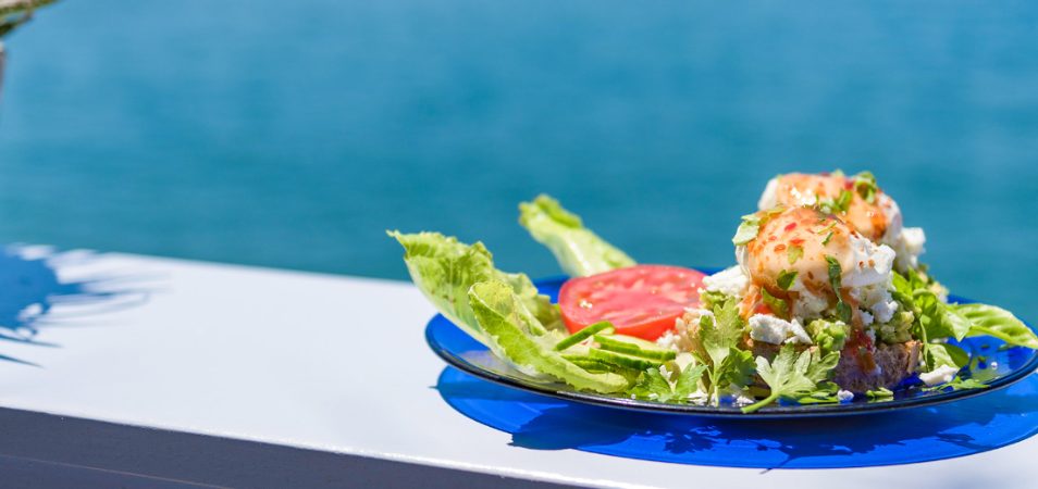 A plate of food with lettuce and tomatoes at a La Jolla, California restaurant.