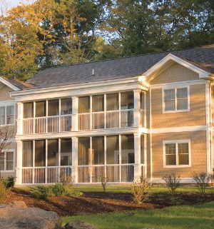 The exterior of Wyndham Shawnee Village, a timeshare resort in the Poconos, Pennsylvania, surrounded by trees and landscaping.