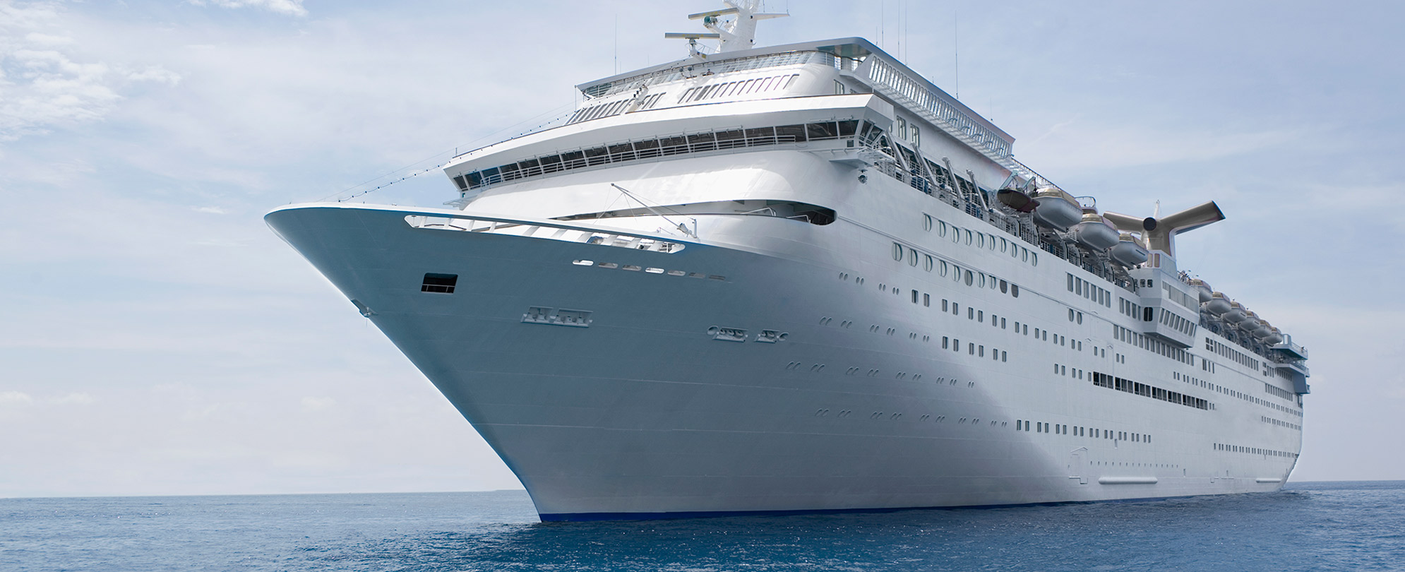 A large cruise ship sailing on the ocean.