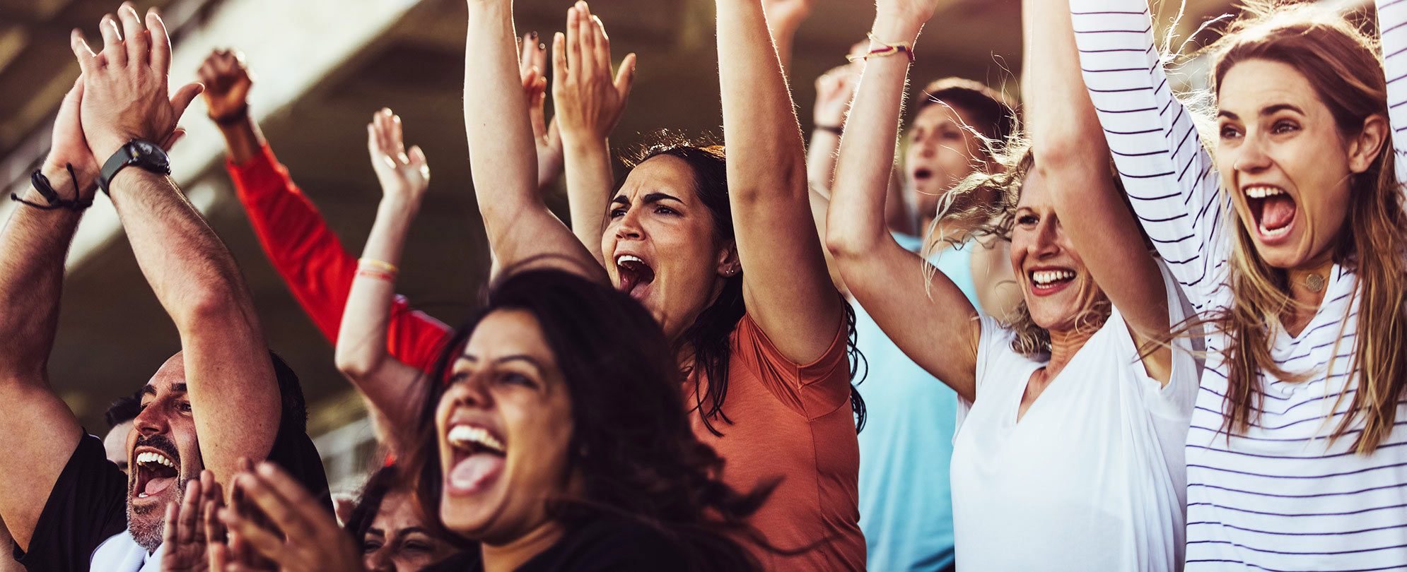 A crowd cheering and clapping